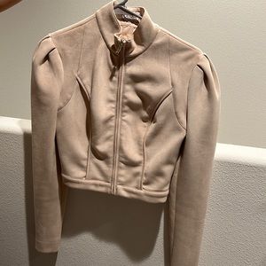 Cropped suede jacket with open back design. House of CB size cream blushed color